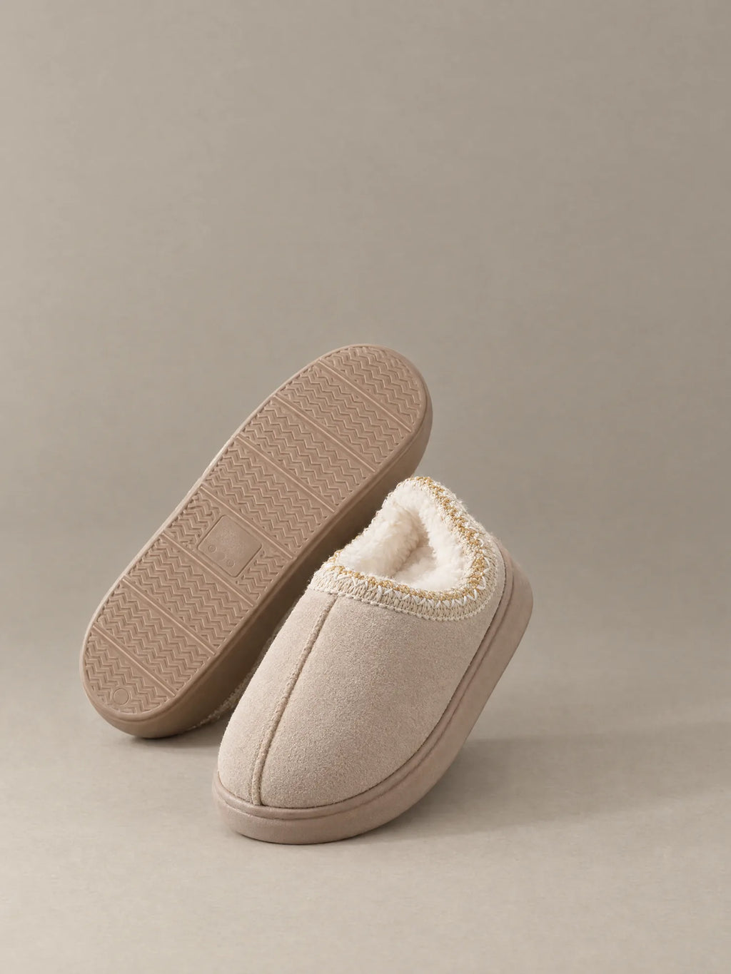 Cloud Fluff Slippers pair showing sherpa lining and sole
